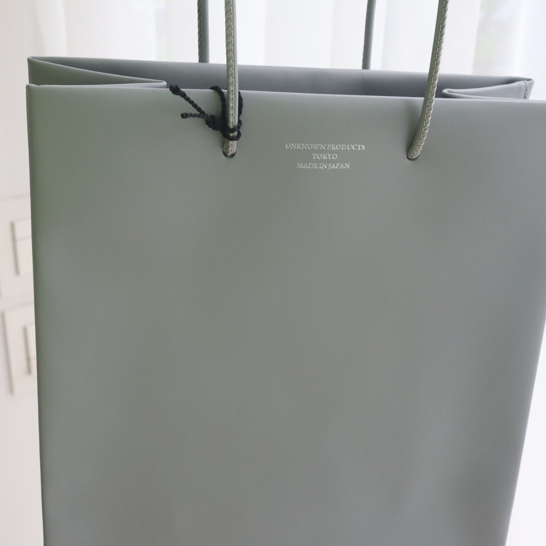 UNKNOWN PRODUCTS  LEATHER PAPER BAG