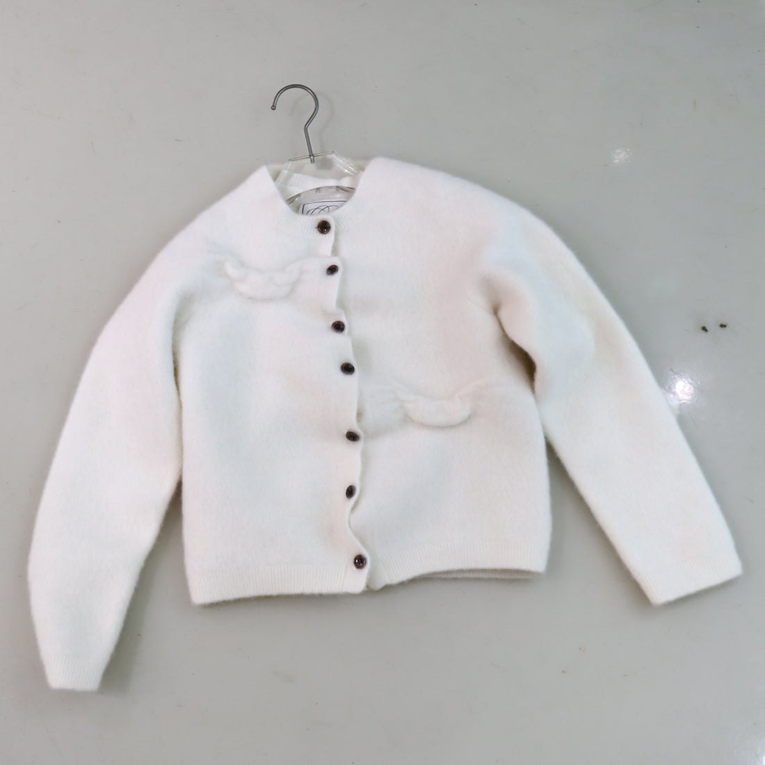 PILLINGS  WHITE CARDIGAN