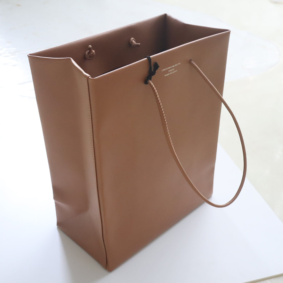 UNKNOWN PRODUCTS  LEATHER PAPER BAG