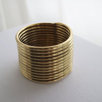 8UEDE  LAWY COILING BANGLE